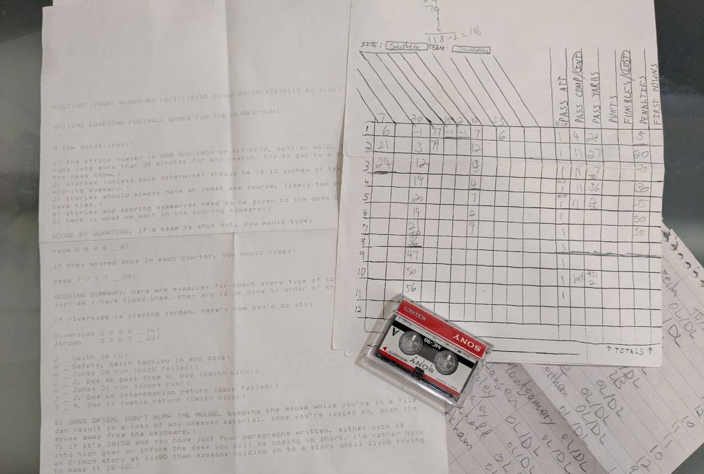 Some artifacts from my days covering high school football: a mini cassette tape, a scoresheet, a hand-copied roster, and a set of instructions for a really antiquated word-processing program.